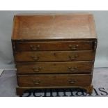 A George III mahogany bureau with four long graduated drawers on bracket feet,