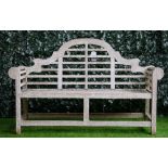 A teak Lutyens style garden bench,