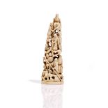 A Japanese ivory group, Meiji period, carved in the round as a tower of figures, unsigned, 16cm.