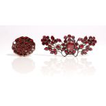 A garnet brooch, in a dished hexafoil design and a foil backed garnet brooch, designed as a spray,