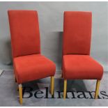 A set of eight modern upholstered hardwood dining chairs,