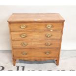 A 19th century mahogany small chest of four long graduated drawers on tapering supports,