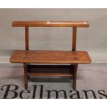 An early 20th century stained pine child's bench, 91cm wide x 77cm high.
