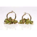 A pair of gold and faceted peridot bead earrings,
