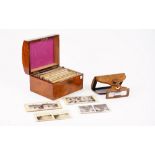 A Swan's patent clairvoyant stereoscope, mid 19th century, fitted in a walnut case,