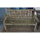 A teak slatted garden bench, 128cm wide x 81cm high.