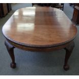 A late 19th century mahogany circular extending dining table, on carved cabriole supports,