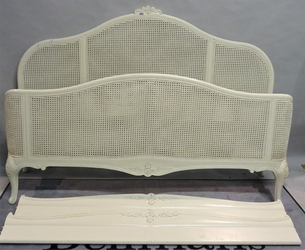 A modern white painted and canework kingsize bed, 185cm wide x 180cm high.