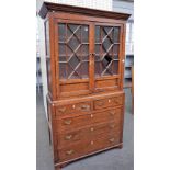 A mid-18th century provincial oak display cabinet chest with a pair of astragal glazed doors over