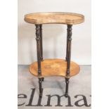 A 19th century continental kidney shaped two tier occasional table on gilt metal mounted ebonised