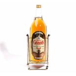 A 4.5l bottle of Grants Finest Scotch Whisky 43% Vol, in a cradle.