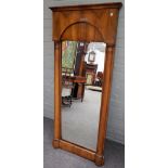 An early 19th century Biedermeier fruitwood rectangular mirror, with split turned column mounts,