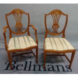 A set of six George III style stained beech shield back dining chairs including two carvers,