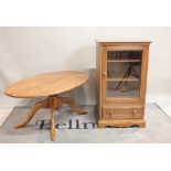 'ERCOL' ; A modern oval coffee table on four downswept supports, 122cm wide x 51cm high,