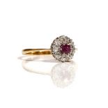 An 18ct gold, ruby and diamond set nine stone cluster ring,