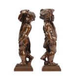 In the manner of Alfred Stevens (1817-1875), a pair of bronze fire dogs, modelled as putti,