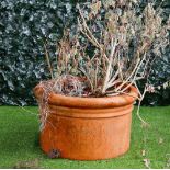 A pair of large circular terracotta planters, 72cm diameter x 44cm high, (a.f), (2).