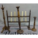 A group of three modern stained beech candlesticks the tallest 89cm high and a late 19th century