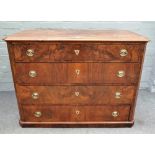 An early 19th century Continental figured walnut chest of four long graduated drawers,