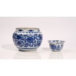 A Chinese blue and white bowl, 17th/18th century, painted with lotus flowers and tendrils,