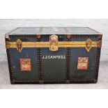An early 20th century brass and metal bound travelling trunk with Cunard, White Star labelling,