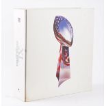 An Opus Super Bowl XL limited edition number 00456 book, with case, paperwork and white gloves.