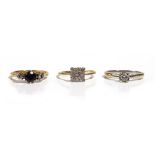 An 18ct gold, sapphire and diamond set three stone ring, ring size M, gross weight 3.