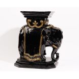 A modern black and gold glazed pottery jardiniere stand, modelled as an elephant, 49cm high.