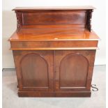A late Victorian mahogany chiffonier with arch panelled doors on plinth base,