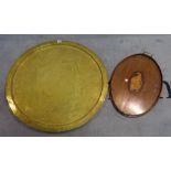 A large early 20th century Eastern embossed brass circular tray,