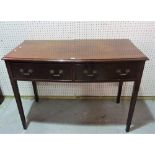 A George III style mahogany bowfront two drawer side table on tapering square supports,