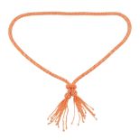 A coral bead sautoir necklace the front with two pendant tassel drops, gross weight 125gms,
