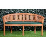 Asian Approach; a hardwood semi-elliptic garden bench, of slatted construction,