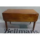 A William IV mahogany drop flap Pembroke table on reeded, tapering supports,