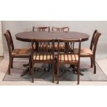 A modern Regency style mahogany twin pillar dining table together with six matching chairs,