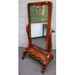 A Regency mahogany cheval mirror with scroll supports and serpentine base on four downswept