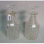 A pair of late Regency cut glass decanters, with stepped necks, 28cm tall.