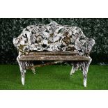 After Coalbrookdale; a fern and blackberry pattern green and white painted cast iron garden bench,