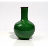 A Chinese green green-ground crackle glazed bottle vase, 24 cm. high.