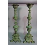 A pair of modern bronze effect candlesticks,