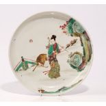 A Chinese polychrome dish, 20th century, enamelled with a woman with a deer in a landscape, 27cm.