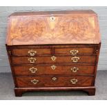 A mid-18th century feather banded figured walnut bureau,