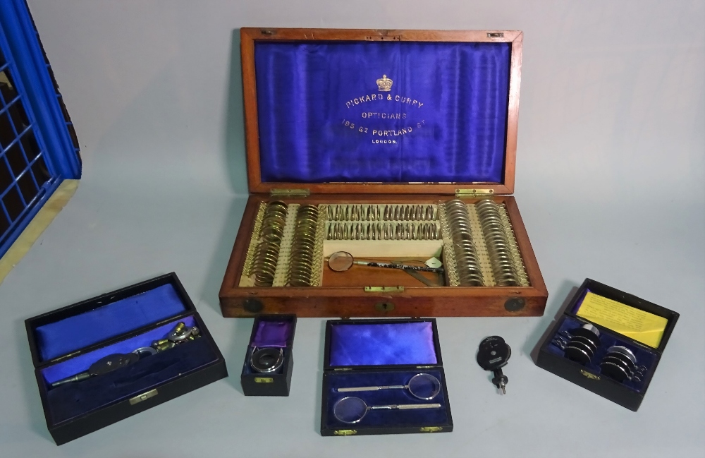 A group of early 20th century optometrist's equipment, cased.