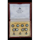 A 9ct gold, mother-of-pearl and green enamelled gentleman's dress set,