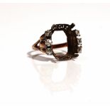 A gold and diamond set ring mount, (the central gemstone lacking),