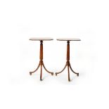 A pair of Regency brass bound mahogany tripod occasional tables,