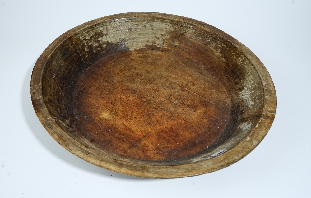 A large shallow turned hardwood fruit bowl, 59cm diameter x 11cm high. - Image 2 of 3