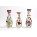 Two Japanese Imari vases, Meiji/ Taisho period, of similar slender baluster form,