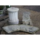 A reconstituted stone curved bench on a pair of scroll supports, 140cm wide,