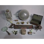 Collectables including; a serpentine paperweight, a miner's lamp, a magnifying glass,